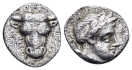 PHOKIS, Federal Coinage. Circa 354-352 BC. Obol (Silver, 11 mm, 0.72 g, 9 h), struck under Onymarchos. Head of a bull facing. Rev. Φ-Ω Laureate head o...