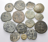 BYZANTINE. Circa 6th-11th century. (Bronze, 121.00 g). A lot of Fifteen (15) bronze coins, mostly Byzantine folles. Patinated. An attractive lot. Fine...
