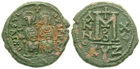 "Justin II. 565-578. AE follis (31.4 mm, 15.32 g, 11 h). Cyzicus mint, Year 10 = 574/575. D N IVSTINVS PP AV, Justin II and Sophia seated on throne fa...