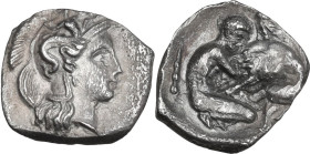 Greek Italy. Southern Apulia, Tarentum. AR Diobol, c. 325-280 BC. Obv. Helmeted head of Athena right, helmet decorated with Scylla hurling stone. Rev....