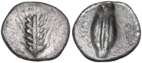 Greek Italy. Southern Lucania, Metapontum. AR Diobol, c. 470-440 BC. Obv. Ear of barley with six grains; no ethnic. Rev. Incuse barley grain; flanked ...