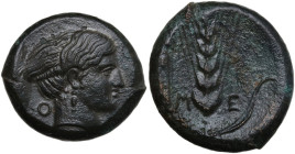 Greek Italy. Southern Lucania, Metapontum. AE Obol, c. 400-350 BC. Obv. Head of Nike right; O behind; below, [NIKA]. Rev. M-E. Ear of barley with six ...