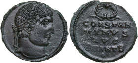 Constantine I (307-337 AD.). AE Follis, Antioch mint,. Obv. No legend. Laureate head right. Rev. Wreath above CONSTAN TINVS AVG SMANTB in four lines; ...