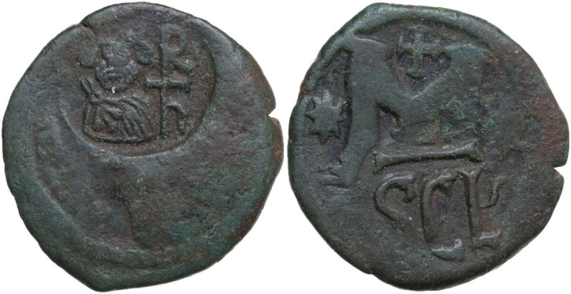 Heraclius (610-641). AE Follis, overstruck on a Follis of Justin I for Nicomedia...