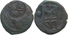 Heraclius (610-641). AE Follis, overstruck on a Follis of Justin I for Nicomedia. Syracuse mint, 615/6-627/8. Obv. Bust of Heraclius facing, monogram ...