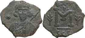 Tiberius III, Apsimar (698-705). AE Follis. Syracuse mint, 698-701. Obv. Crowned and cuirassed bust facing, holding spear and shield decorated with ho...