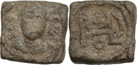 Lead square Weight, Syracuse(?) 7th-8th centuries AD. Obv. Facing head. SCS(?) to left. Rev. Composite monogram. PB. 11.69 g. 16.00 mm. VF.