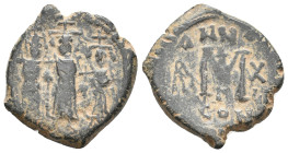 Islamic, Arab-Byzantine. Imitation of a HERACLIUS, MARTINA and HERACLIUS CONSTANTINE. 610-641 AD. AE, Follis. Constantinople. 6.93 g. 23.55 mm.
