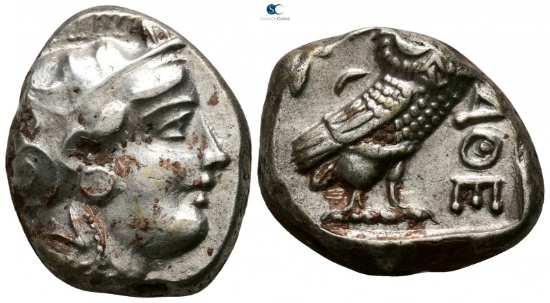 Attica. Athens 355-294 BC. 
Tetradrachm AR

23mm., 15,55g.

Head of Athena ...