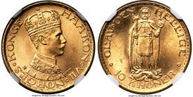 Haakon VII gold 10 Kroner 1910 MS65 NGC, Kongsberg mint, KM375, Fr-20. Mintage: 52,600. One year type. A delightful Gem with satiny surfaces enveloped...