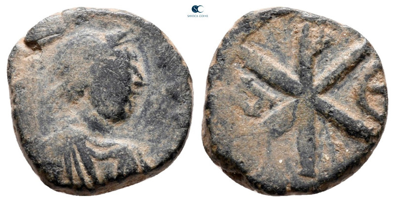 Justin I AD 518-527. Constantinople
Pentanummium Æ

14 mm, 2,27 g



very...