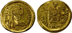 BYZANTINE EMPIRE: Justinian I, 527-565, AV solidus (4.47g), Constantinople, S-140, helmeted and cuirassed bust, holding globus cruciger & shield // an...