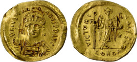 BYZANTINE EMPIRE: Justinian I, 527-565, AV solidus (4.36g), Constantinople, S-140, helmeted and cuirassed bust, holding globus cruciger & shield // an...