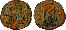 ARAB-BYZANTINE: Justin & Sophia type, ca. 690s, AE follis (4.96g), year "18", A-3509.2, an unusual imitation, obverse with a standing caliph to the le...