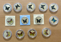 WORLDWIDE: LOT of 13 coins, featuring Butterflies, all from Palau; some are silver, all are crown-sized, all with holograms, all in proof, in consigno...