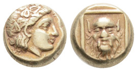 LESBOS. Mytilene. EL Hekte (Circa 377-326 BC)..
Obv: Head of Dionysos right, wearing ivy wreath.
Rev: Facing head of Silenos within linear square.
Bod...