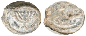 Judaea, Personal PB Token of Rolanos(?). Circa 5th-6th centuries AD.
Obv: Menorah of seven branches, flanked by lulav and etrog.
Rev: POΛANOY in two l...