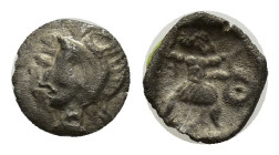 ASIA MINOR. Uncertain. 4th century BC. Tetartemorion (Silver, 6mm, 0.18 g). Bearded male head to left, wearing crested helmet. Rev. Slinger standing i...