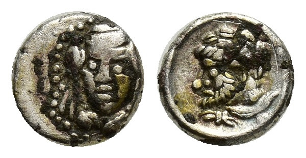 Cilicia, uncertain mint AR Obol. (7mm, 0.41 g) 4th century BC. Veiled and draped...