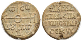 BYZANTINE LEAD SEAL. (27mm, 17 g) 9th century. Obv : Invocative monogram for TW CW ΔΥ ΛW. Rev : Legend in five lines.