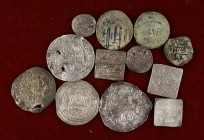 Lote formado por 3 monedas hispanoárabes de cobre y 9 de plata. 12 piezas en total. MC/MBC.