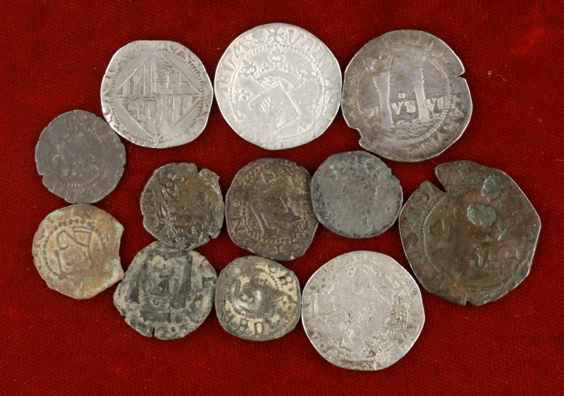Juana y Carlos. Lote de 12 monedas, cuatro en plata (1 real), todas diferentes. ...
