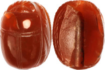 Egyptian Red Carnelian Scarab. New Kingdom, ca. 1550-1069 B.C. 1.51 gms. FINE.
Diameter: 14mm. With incisions to define the body, but the bottom unin...