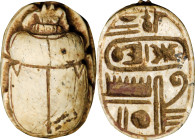 Egyptian White Steatite Scarab. New Kingdom, 18th Dynasty, ca. 1479-1425 B.C. 1.44 gms. VERY FINE.
cf. a light beige scarab with a green-blue glaze i...