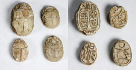 Group of Four Egyptian Glazed Steatite Scarabs. ca. 1550-924 B.C. Average Grade: FINE.
Comprising a large scarab with two cartouches with the royal n...