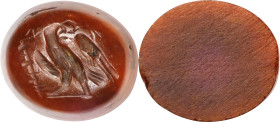 Roman Dark Red Carnelian Intaglio. ca. 2nd-3rd century A.D. 1.73 gms. VERY FINE.
Dimensions: 15 x 13mm. Incised with an eagle standing left on a grou...