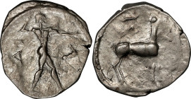 ITALY. Bruttium. Kaulonia. AR Stater (7.40 gms), ca. 475-425 B.C. VERY FINE.
HGC-1, 1419; HN Italy-2046. Obverse: Apollo advancing right, holding bra...