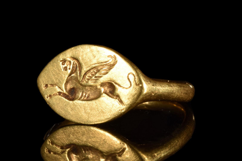 PTOLEMAIC GOLD SEAL RING WITH GRYPHON
Ca. 400-300 BC. 
Hellenistic Period, pos...