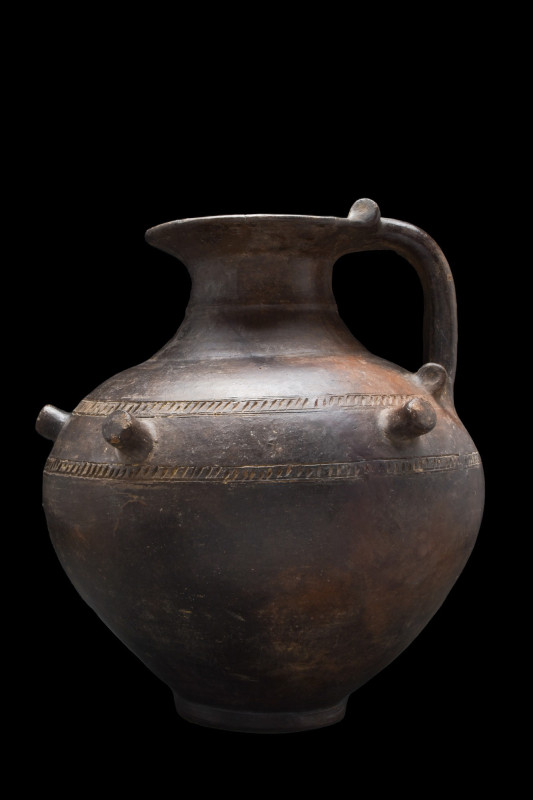 VILLANOVAN POTTERY VESSEL
Ca. 700-600 BC. 
A one-handled pottery vessel of a w...
