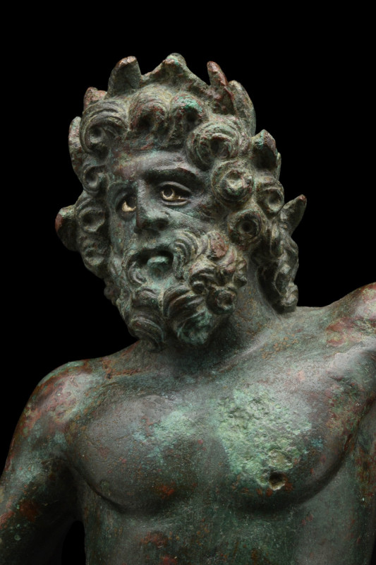 A BRONZE STATUETTE OF JUPITER DEPICTING ZEUS BRONTAIOS
Ca. 100 AD. 
A bronze s...