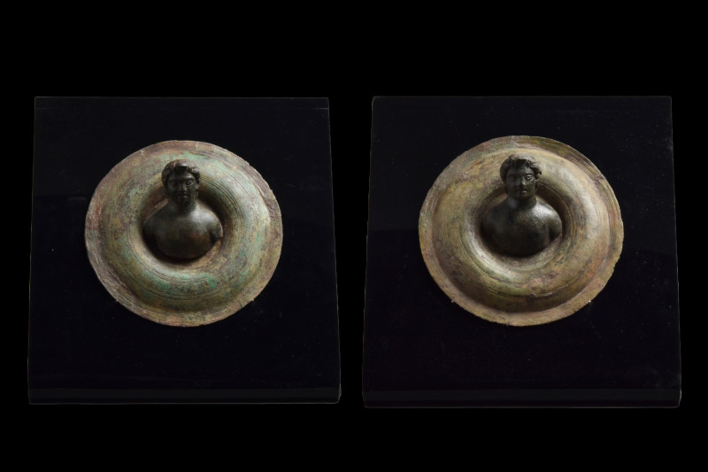 ROMAN BRONZE CHARIOT FITTINGS PAIR WITH MALE BUSTS
Ca. 100-300 AD. 
A pair of ...