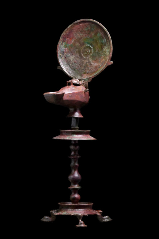 LARGE ROMAN BRONZE LAMP ON STAND
Ca. 200 AD. 
A cast bronze decorative tripod ...