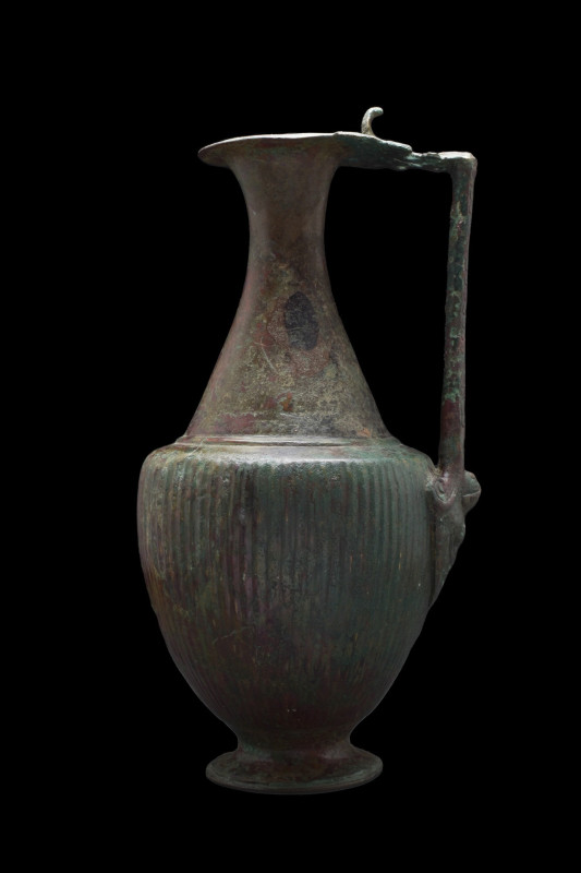 LARGE ANCIENT ROMAN BRONZE OLPE
Ca. 400-500 AD. 
A Late Roman bronze jug risin...