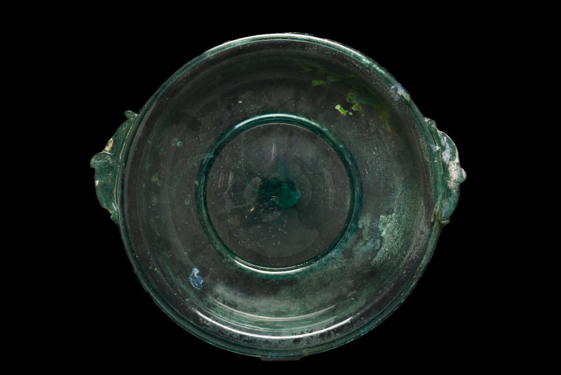 ROMAN GLASS PLATE
Ca. 50-300 AD. 
A stunning glass plate in a greenish-blue fa...