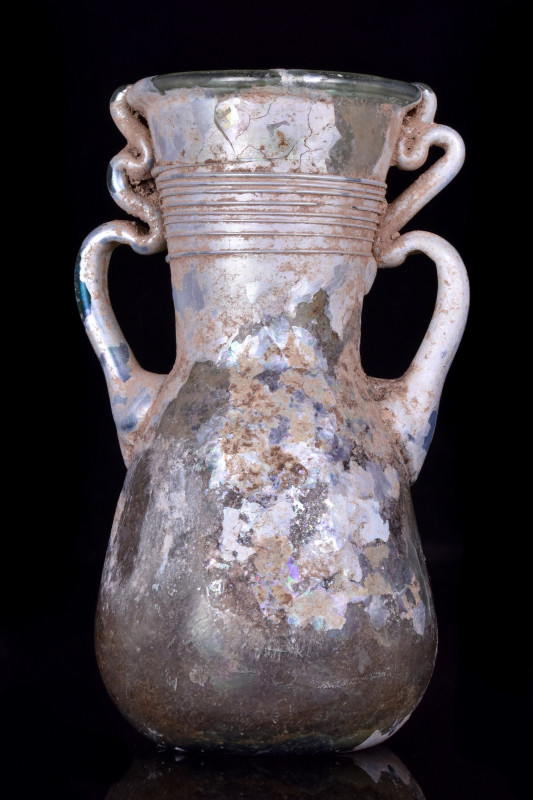 ROMAN GLASS FLASK WITH TRAILED HANDLES
Ca. 100-200 AD. 
A beautiful blown flas...