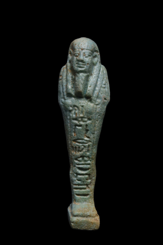 ANCIENT EGYPTIAN FAIENCE USHABTI
Ca. 664-525 BC. 
An ancient Egyptian funerary...