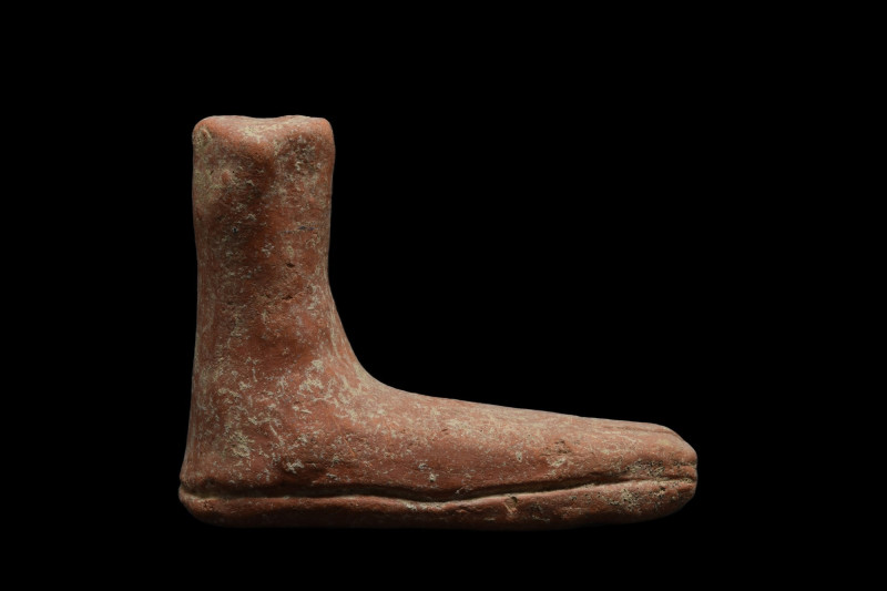 ETRUSCAN VOTIVE POTTERY FOOT
Ca. 700-500 BC. 
A salmon color pottery votive fo...