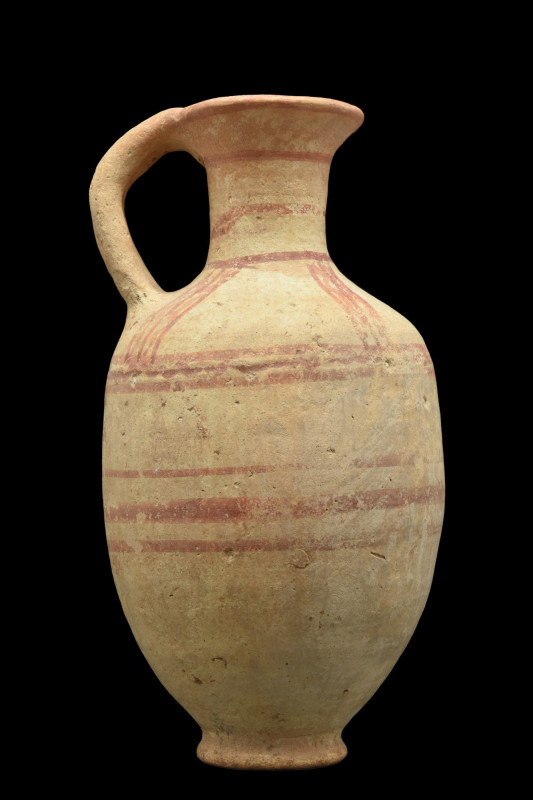 CANAANITE HOLY LANDS POTTERY JUG
Ca. 1900 BC. 
A pottery jug with a strap hand...