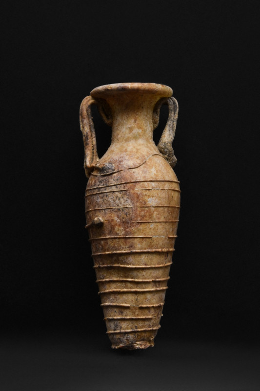 ANCIENT ROMAN GLASS AMPHORISKOS
Ca. 100-300 AD. 
A rare glass amphora or ampho...