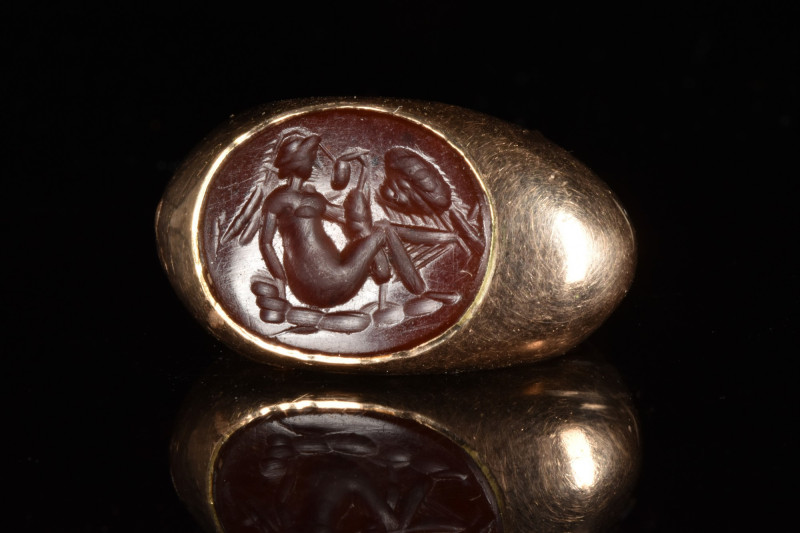 ROMAN CARNELIAN INTAGLIO WITH LEDA AND SWAN IN GOLD RING
Ca. 200 AD. 
A carnel...