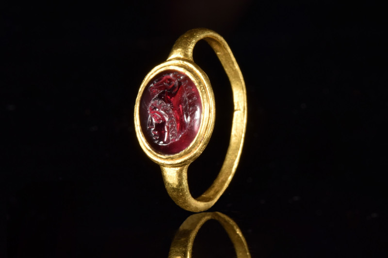 ROMAN GRYLLOS INTAGLIO GOLD RING
Ca. 100 AD. 
A gold finger ring composed of a...