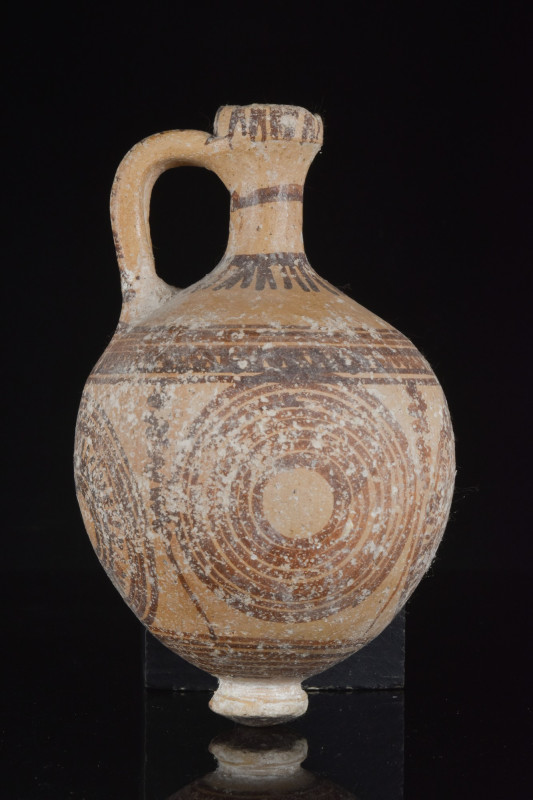 HOLY LAND CANAANITE POTTERY JUG
Middle Bronze Age IIA, Ca. 2000-1730 BC. 
A bu...