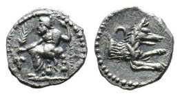 (Silver, 0.60g 10mm)Lykaonia, Laranda. Ca. 324-323 B.C. AR obol . Baaltars seated left, holding grain ear, bunch of grapes, and scepter / Forepart of ...