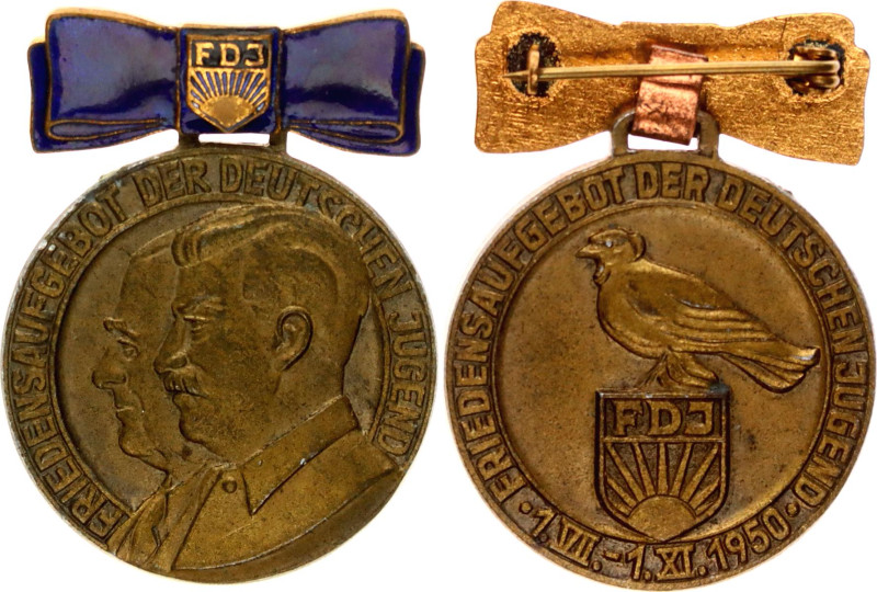 Tin 35 mm.; (Friedensmedaille) The medal shows the left-facing head portraits of...