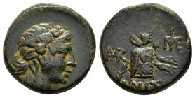 PONTOS. Amisos.(85-65 BC).Ae.

Obv : Head of Dionysos right, wearing ivy wreath.

Rev : AMIΣOY.
Thrysos leaning against cista mystica draped with pant...