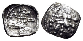 LYCAONIA.Laranda.(Circa 324-323 BC).Obol.

Obv : Baaltars seated left, holding grain ear, bunch of grapes, and scepter.

Rev : Forepart of wolf right;...
